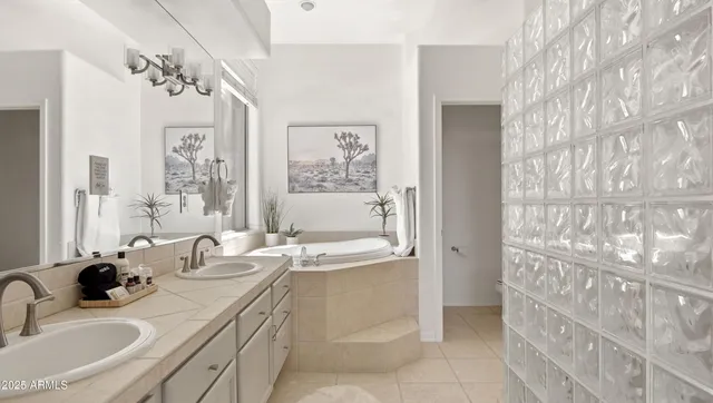a bathroom with a double vanity sink mirror and shower