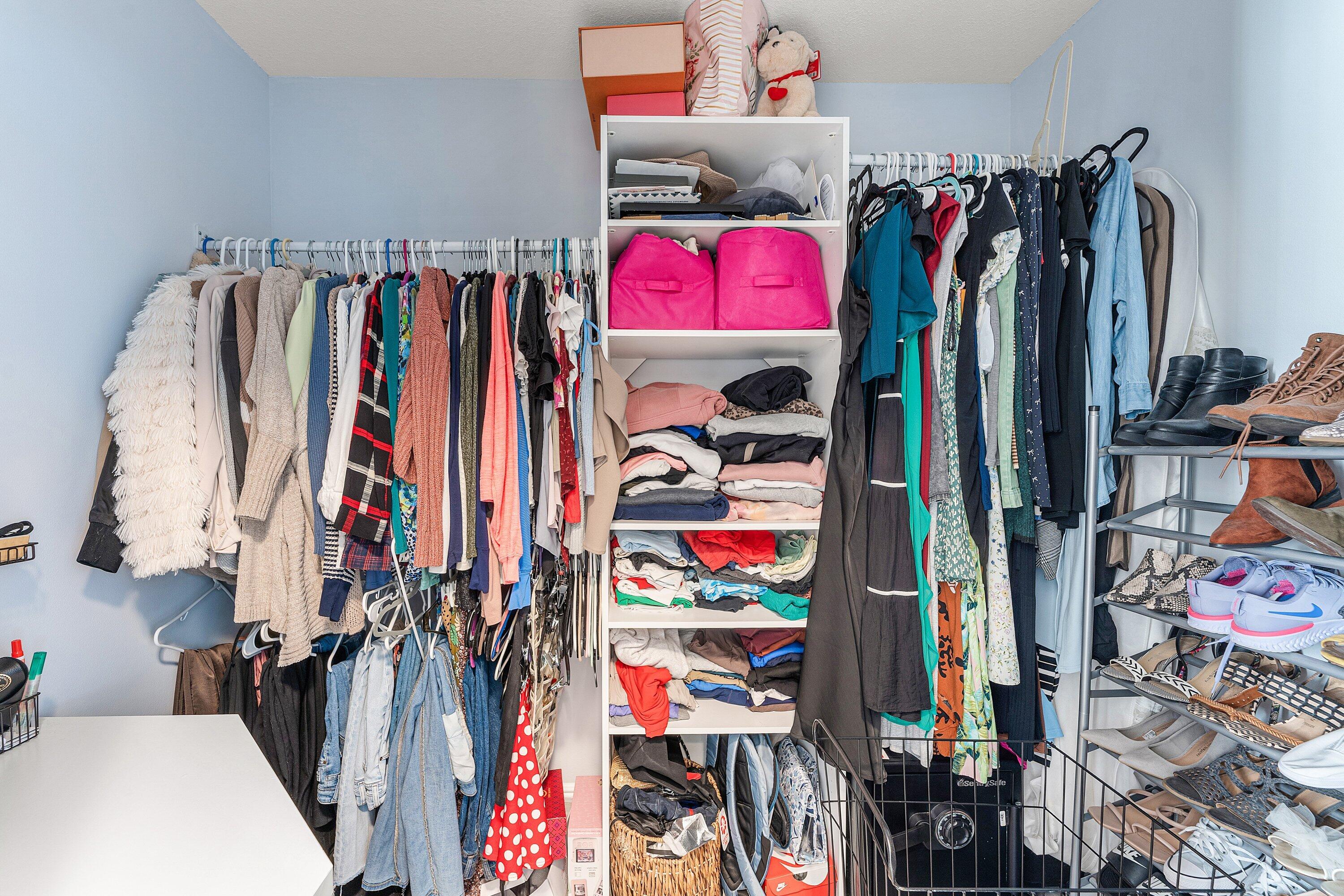 7346 Michigan Isle Road Lake Worth, FL 33467 - Photo 18 of 44 a view of walk in closet with clothes