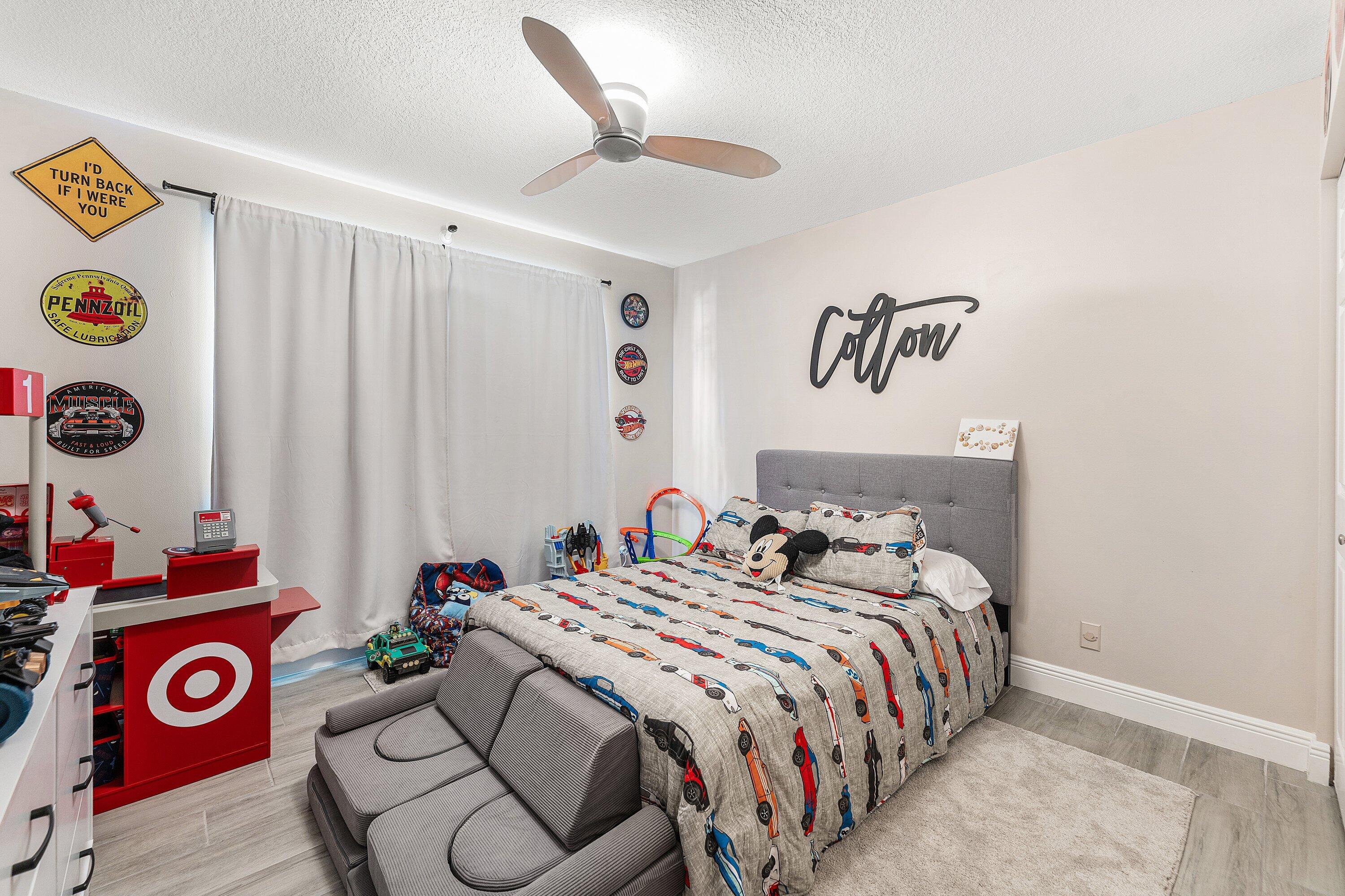 7346 Michigan Isle Road Lake Worth, FL 33467 - Photo 22 of 44 a bedroom with bed and a window