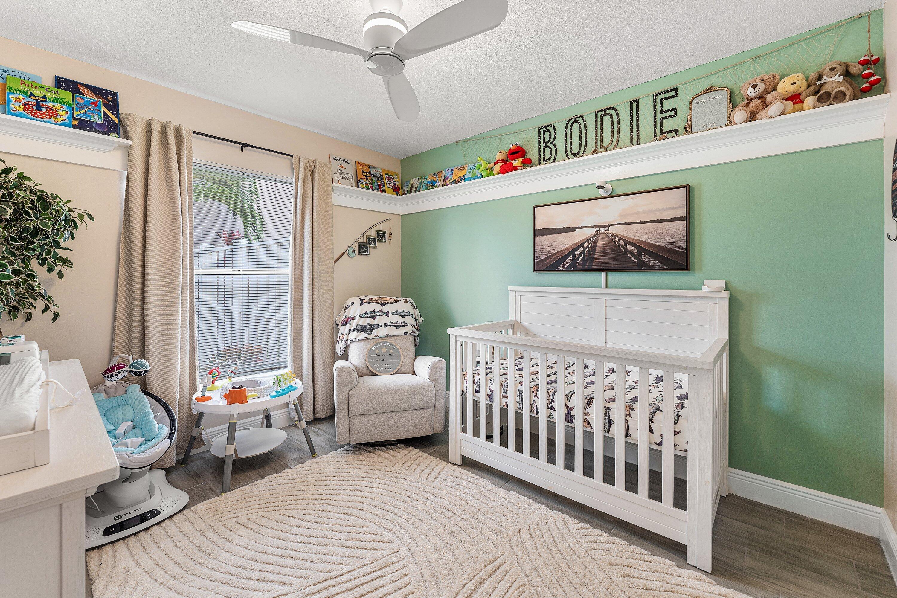7346 Michigan Isle Road Lake Worth, FL 33467 - Photo 24 of 44 a bedroom with furniture and a window