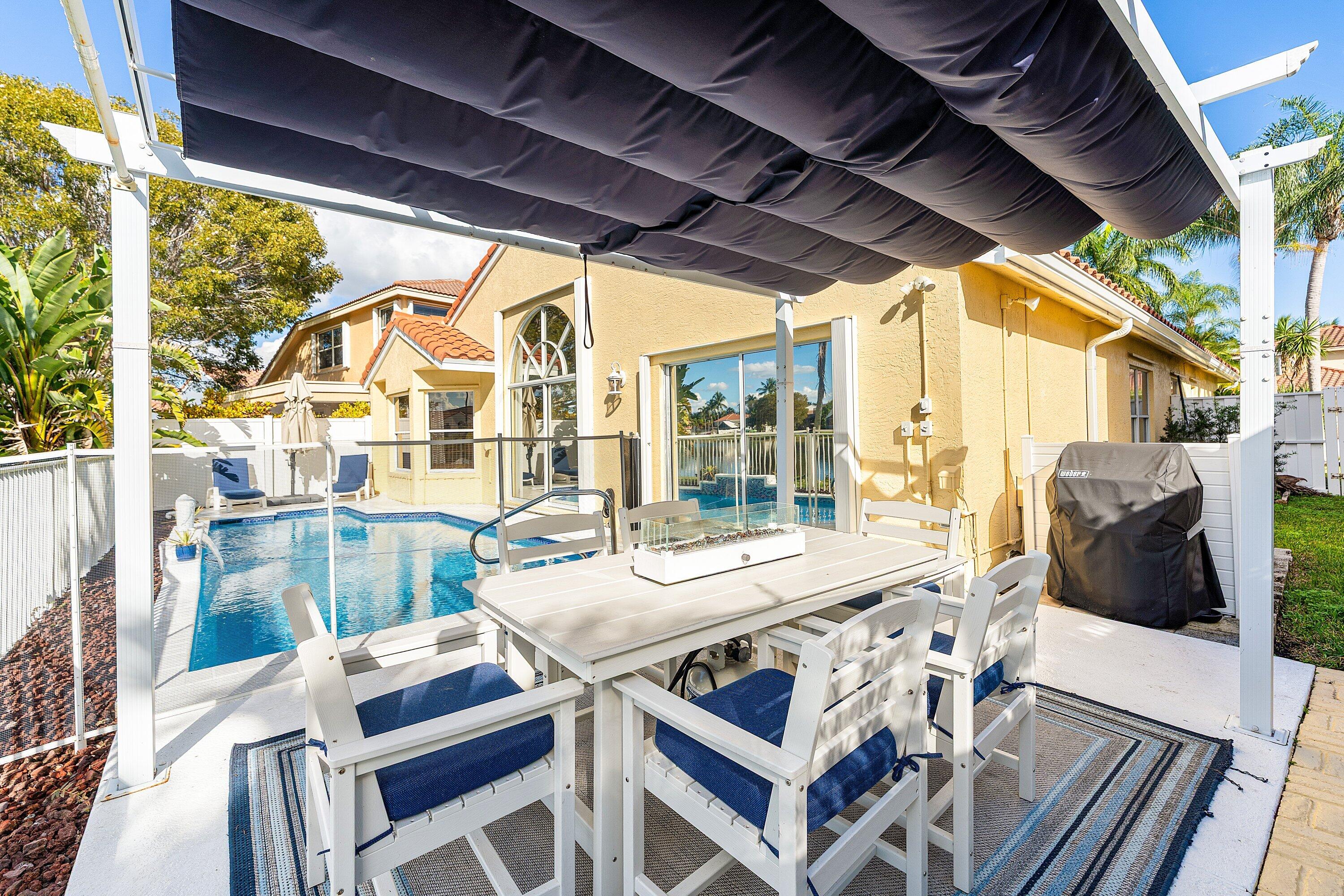 7346 Michigan Isle Road Lake Worth, FL 33467 - Photo 27 of 44 a view of an outdoor space with seating area