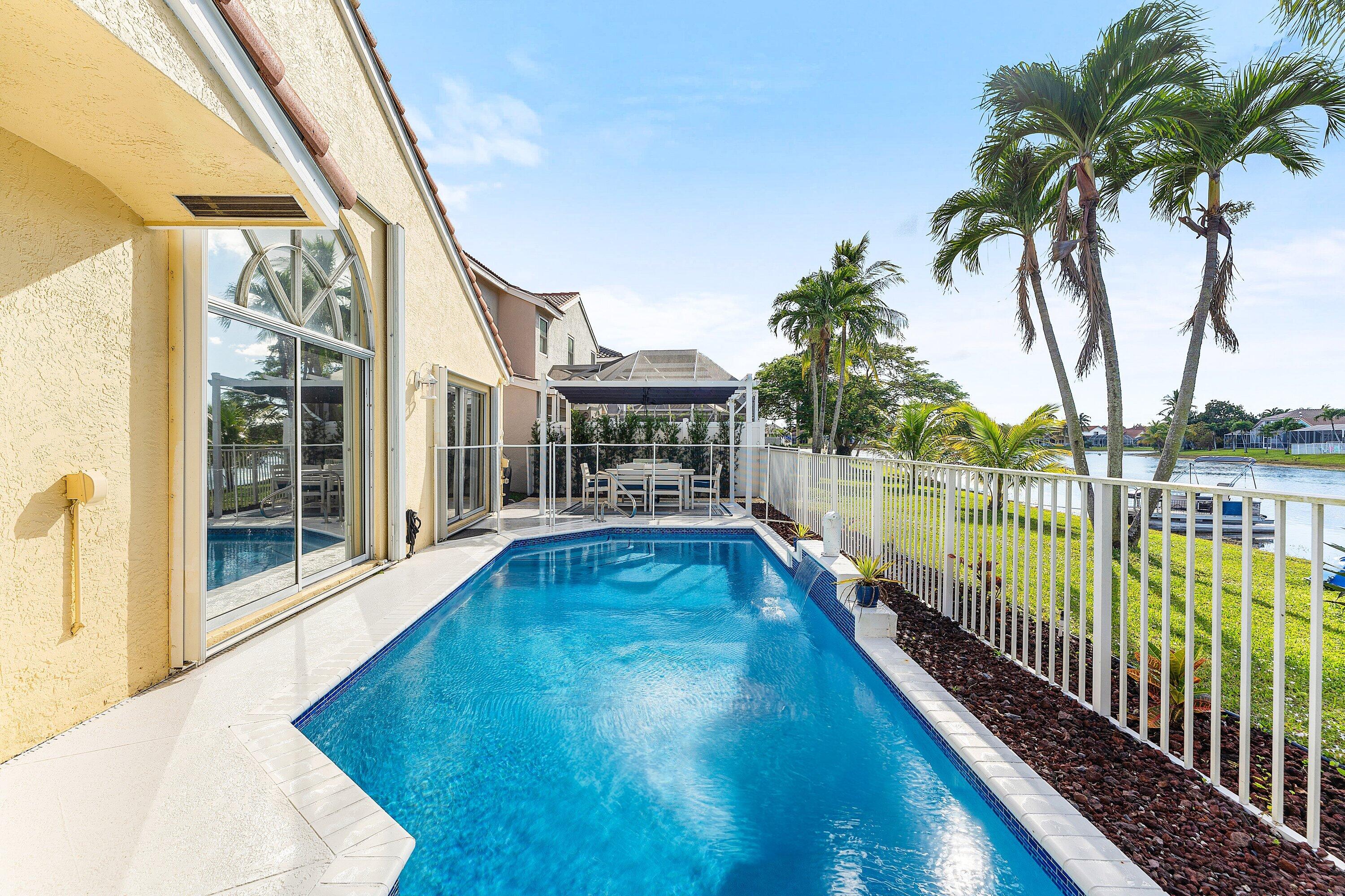 7346 Michigan Isle Road Lake Worth, FL 33467 - Photo 29 of 44 a view of a balcony with lake view