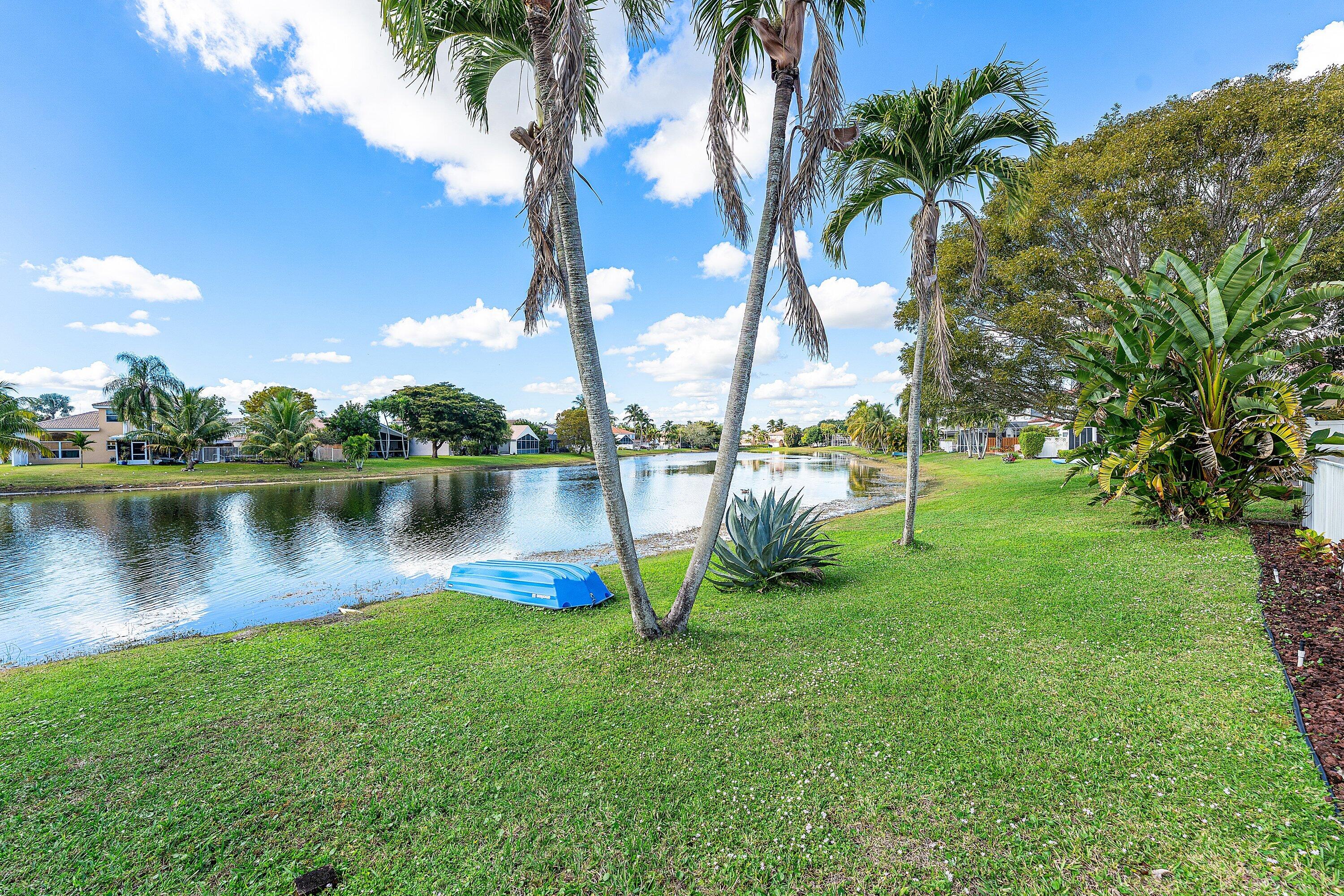 7346 Michigan Isle Road Lake Worth, FL 33467 - Photo 32 of 44 a view of a lake with houses