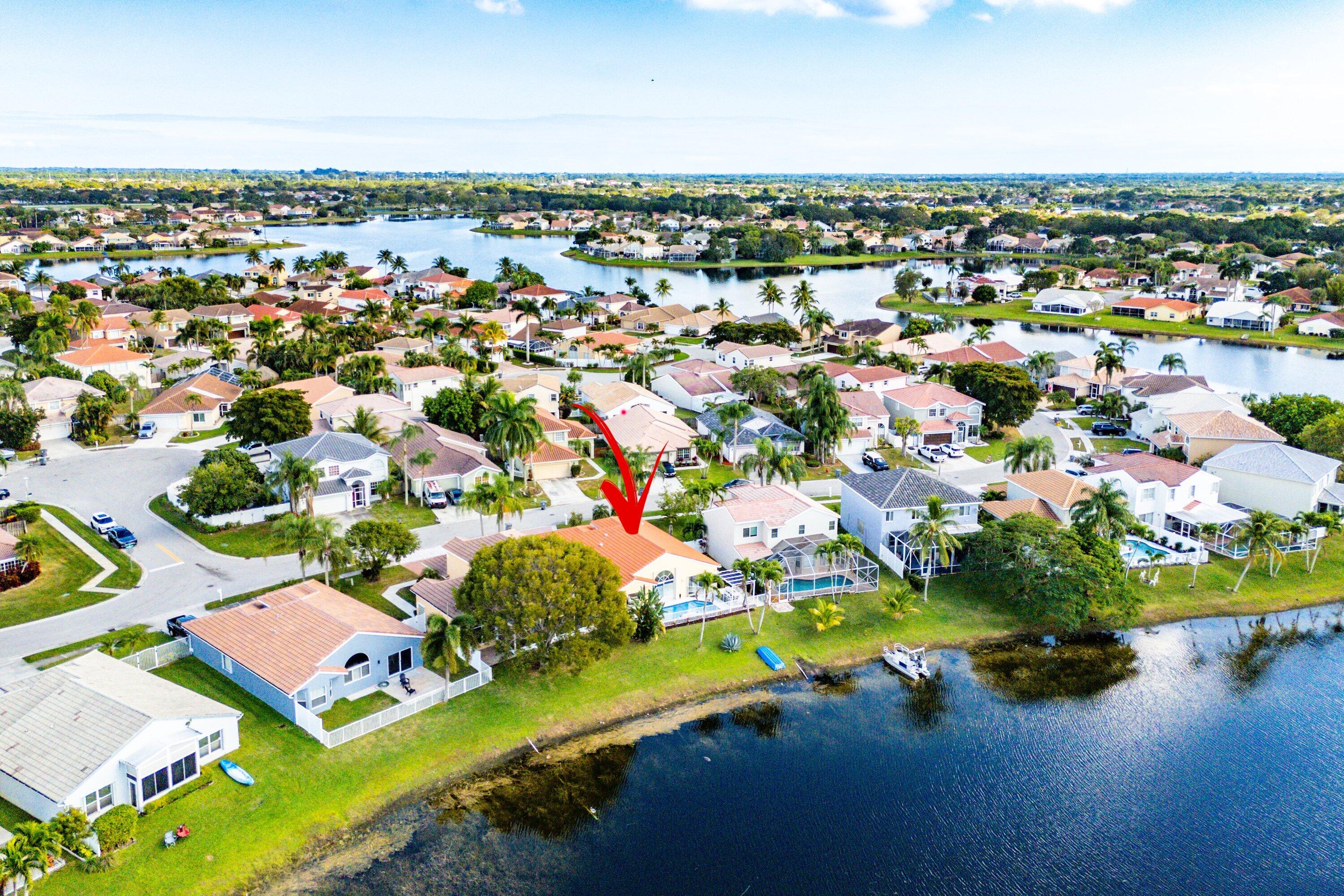 7346 Michigan Isle Road Lake Worth, FL 33467 - Photo 39 of 44 an aerial view of residential houses with outdoor space and river
