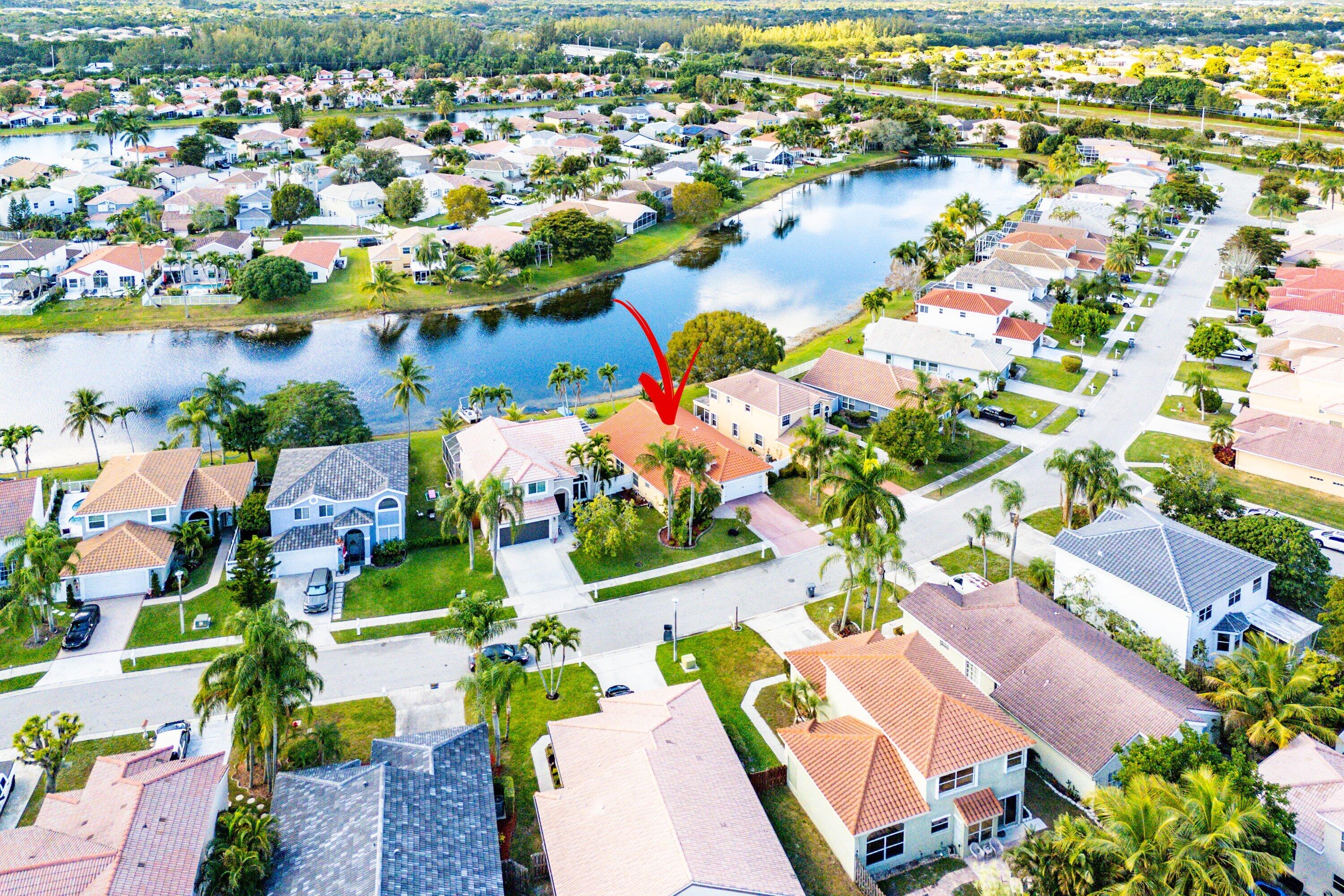 7346 Michigan Isle Road Lake Worth, FL 33467 - Photo 43 of 44 an aerial view of residential houses with outdoor space