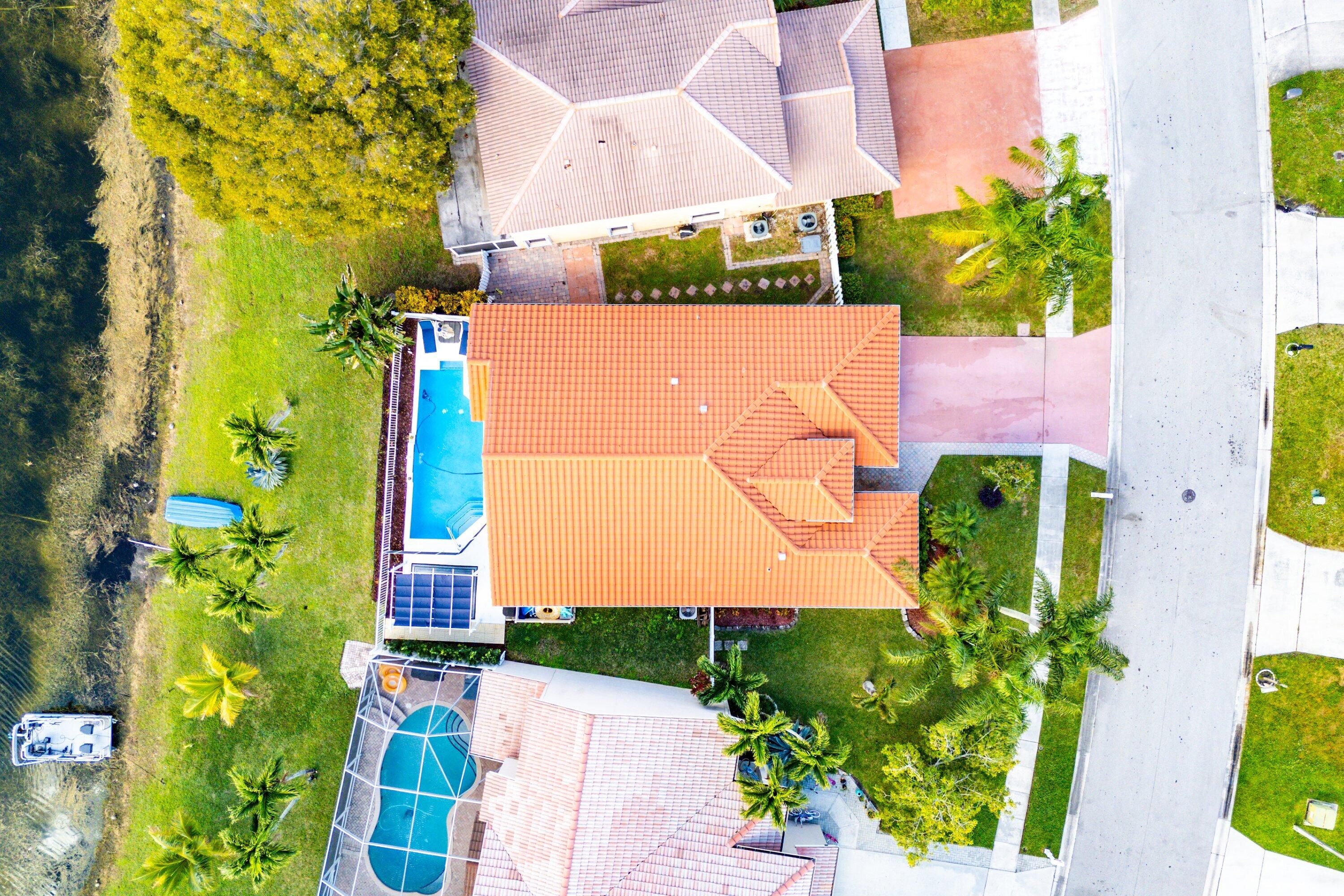 7346 Michigan Isle Road Lake Worth, FL 33467 - Photo 44 of 44 an aerial view of a house with a yard and garden