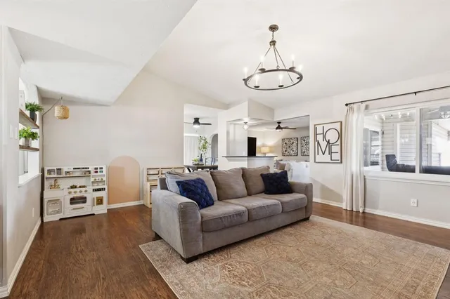 a living room with furniture with wooden floor