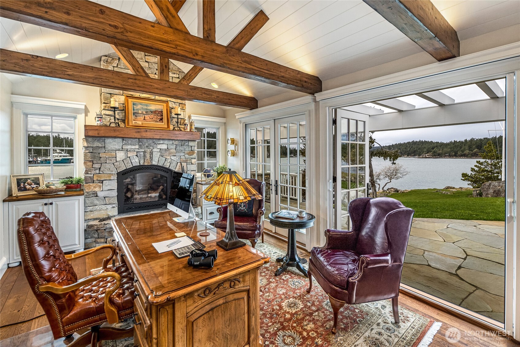 95 Laurel Point Lane Friday Harbor, WA 98250 - Photo 11 of 40 a living room with furniture a fireplace and garden view