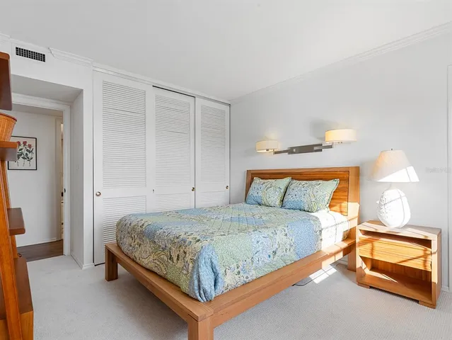 a bedroom with a bed and a cabinets