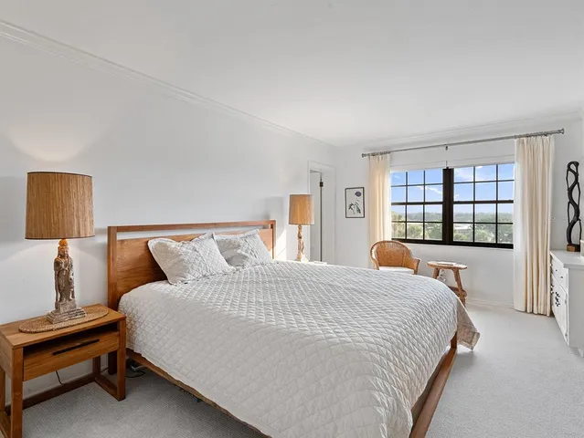 a bedroom with a bed and dresser