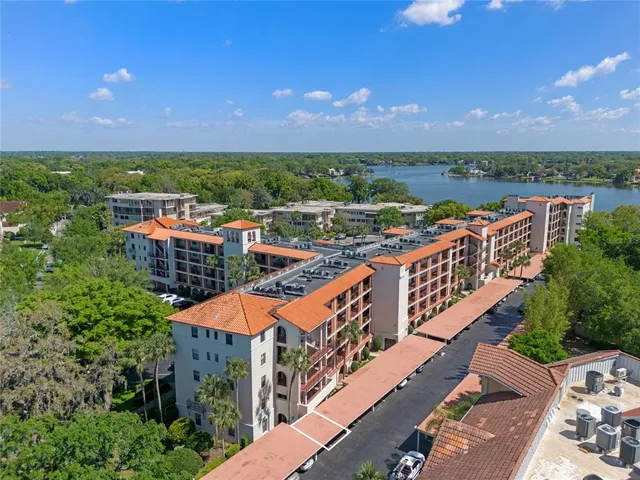 an aerial view of a house a yard and outdoor seating