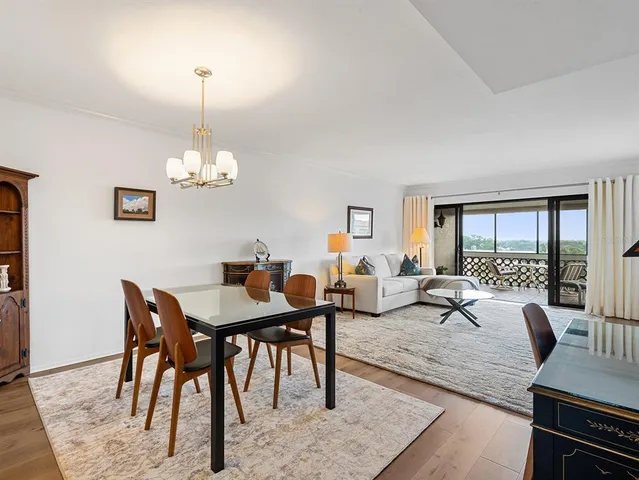 a spacious bedroom with a bed a couch and a window