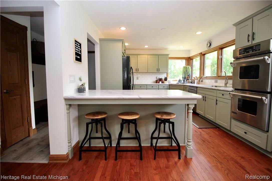 8126 Ruger Ridge Fowlerville, MI 48836 - Photo 11 of 53 Kitchen Island