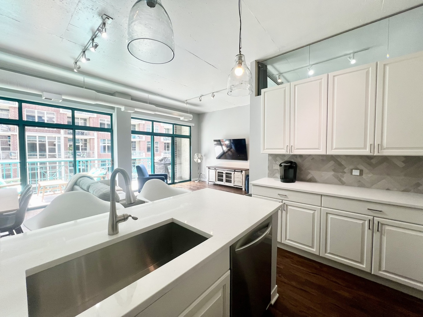 910 West Madison Street, Unit 602 Chicago, IL 60607 - Photo 4 of 13 a large white kitchen with a large window