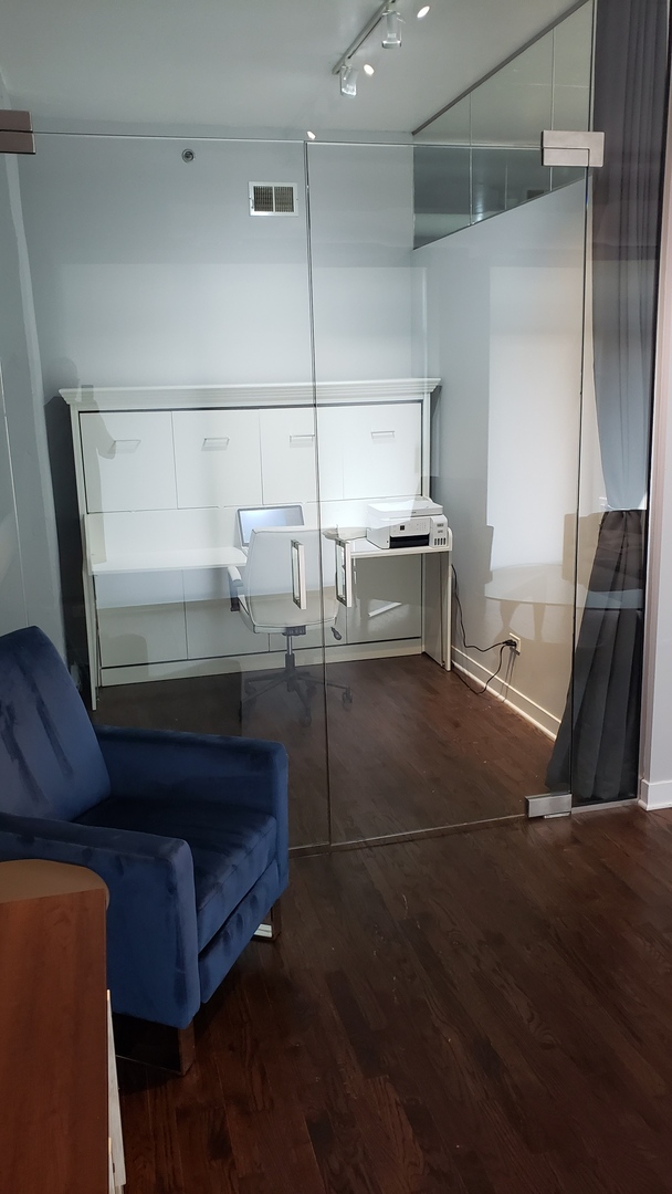 910 West Madison Street, Unit 602 Chicago, IL 60607 - Photo 10 of 13 a bathroom with a sink and a mirror