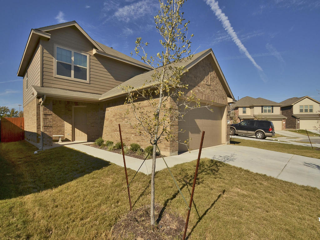6920 Crestone Road Austin, TX 78744 - Photo 1 of 1 a front view of a house with parking space