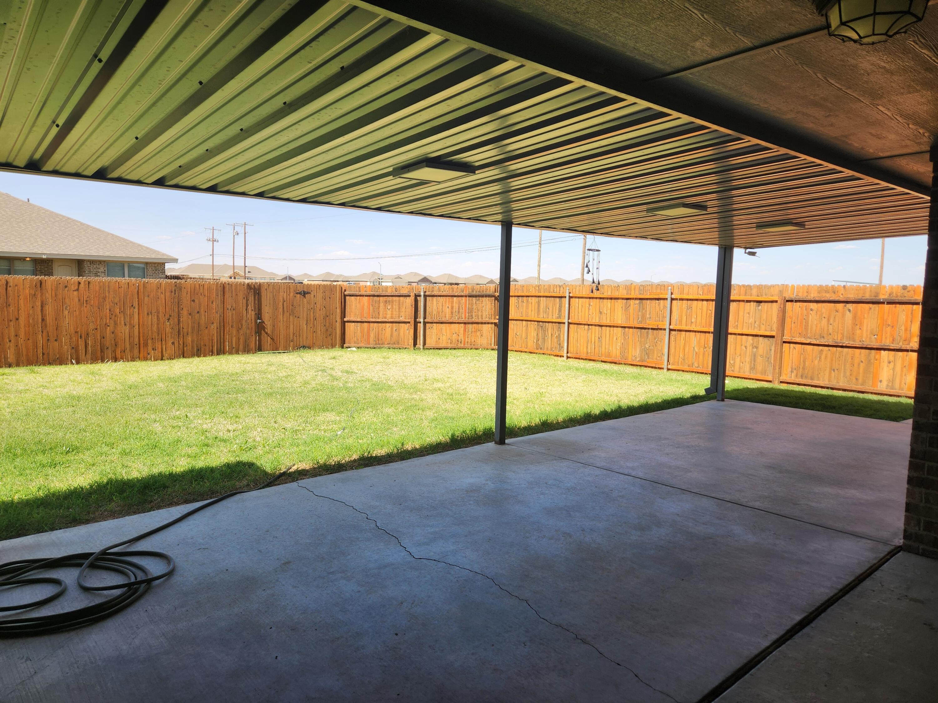 8702 13th Street Lubbock, TX 79416 - Photo 24 of 25 a view of a backyard