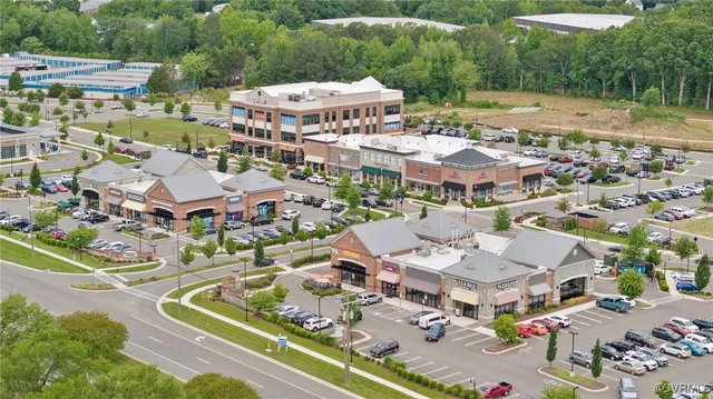 an aerial view of residential houses and outdoor space