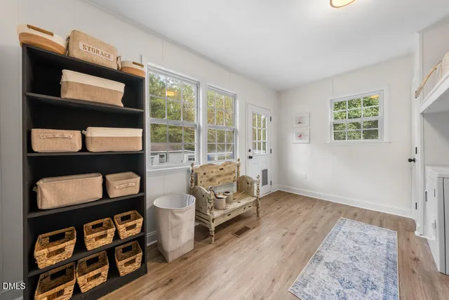 a bedroom with furniture and a window