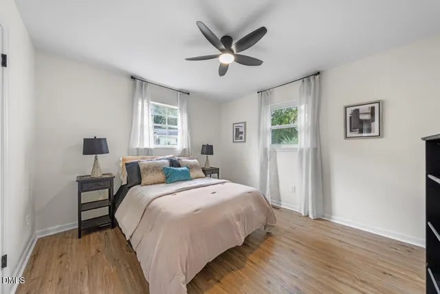 a bedroom with bed and window