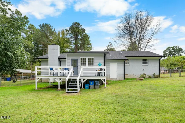 a view of a house with a yard porch and sitting area