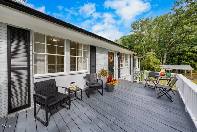 a blue bench sitting in front of a house