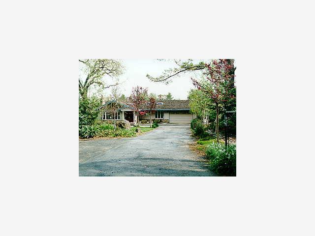 3605 Tripp Road Woodside, CA 94062 - Photo 1 of 1 a picture of a person on a street