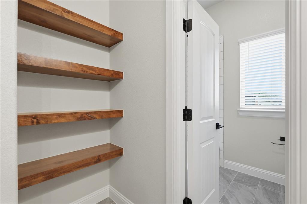 120 Grace Vw Road Weatherford, TX 76088 - Photo 27 of 40 Built-in open shelving with wood-finish planks
