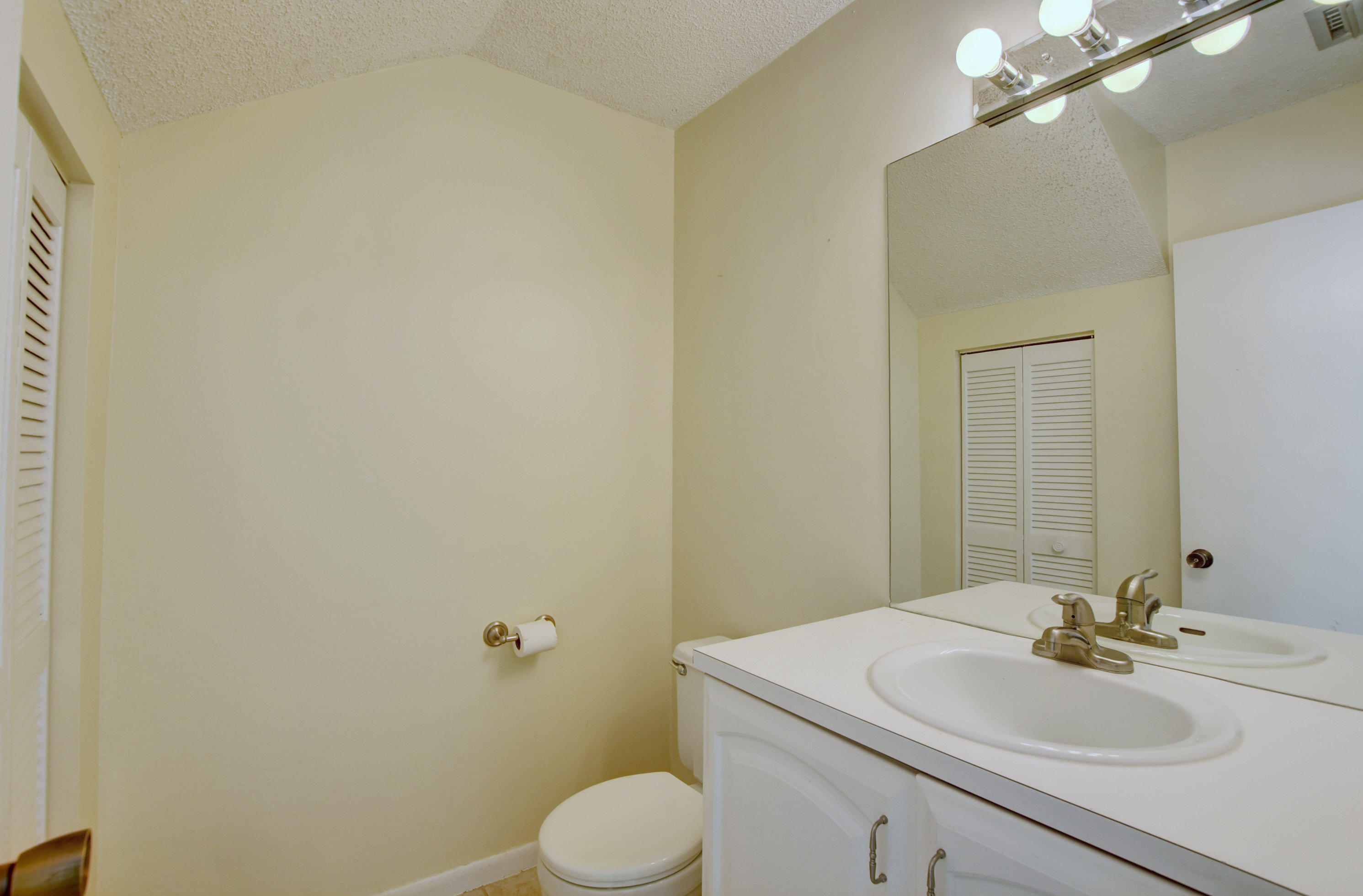 3603 Inlet Circle Greenacres, FL 33463 - Photo 15 of 34 a bathroom with a sink mirror vanity and toilet