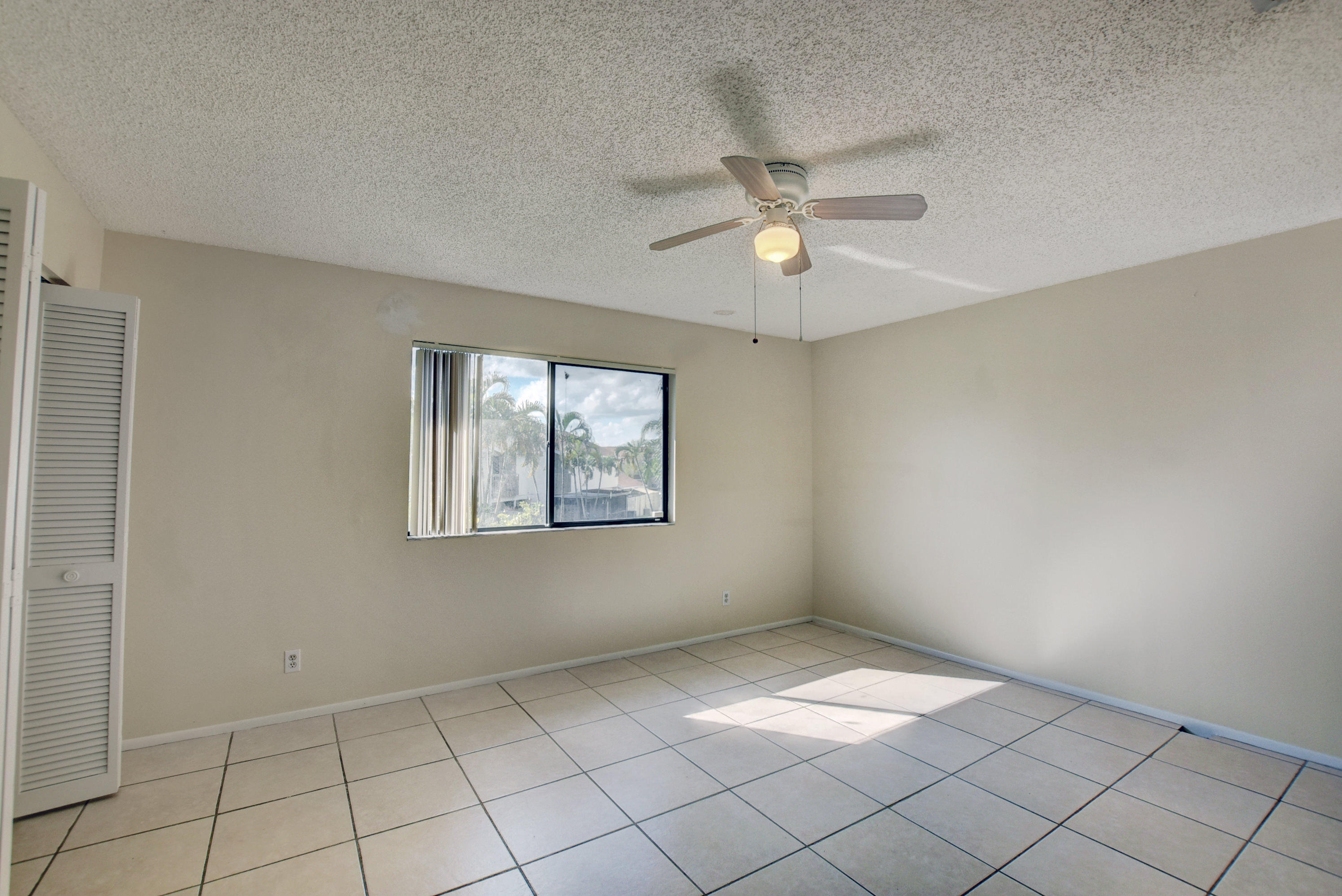 3603 Inlet Circle Greenacres, FL 33463 - Photo 17 of 34 a view of an empty room and window