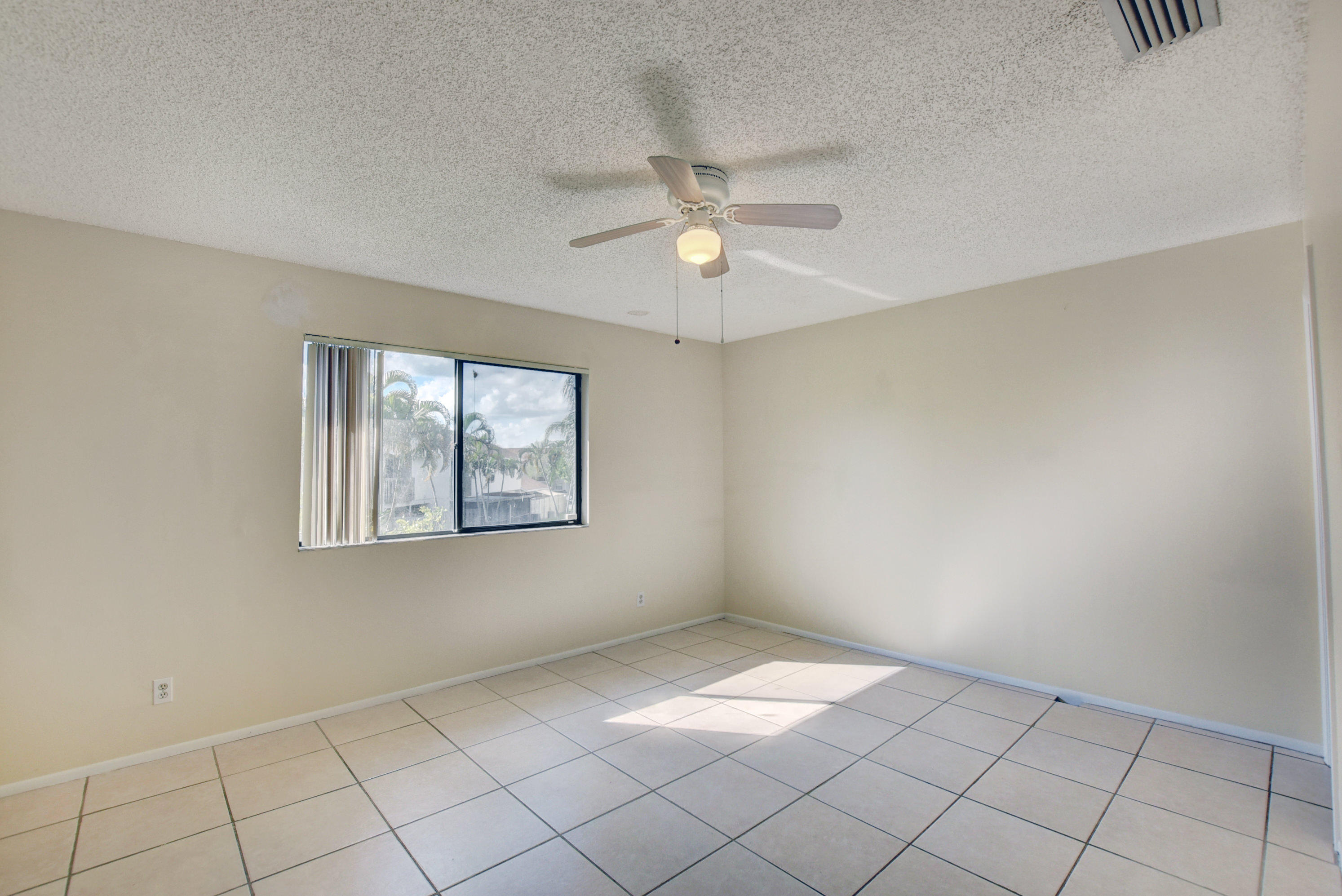 3603 Inlet Circle Greenacres, FL 33463 - Photo 18 of 34 a view of an empty room with a window