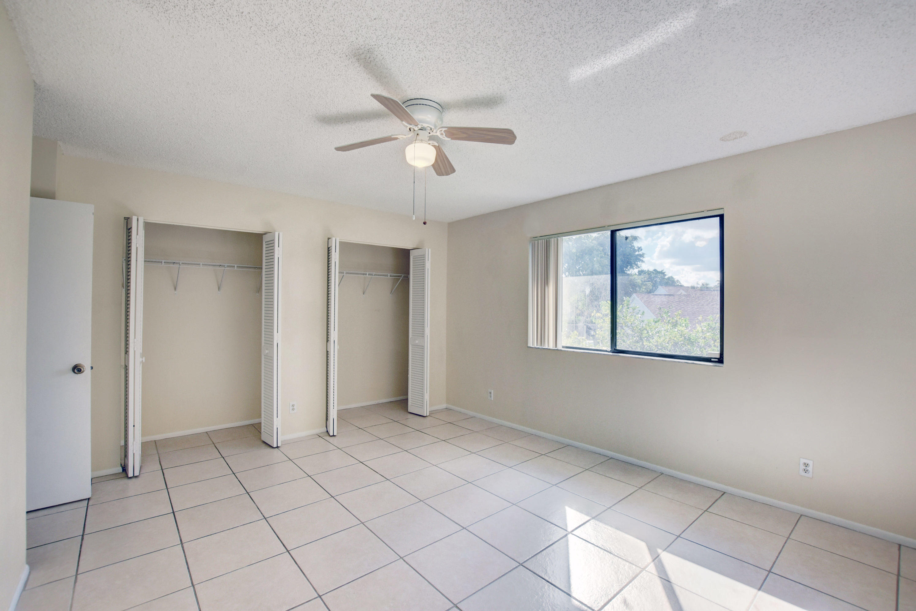 3603 Inlet Circle Greenacres, FL 33463 - Photo 19 of 34 a view of an empty room with a window