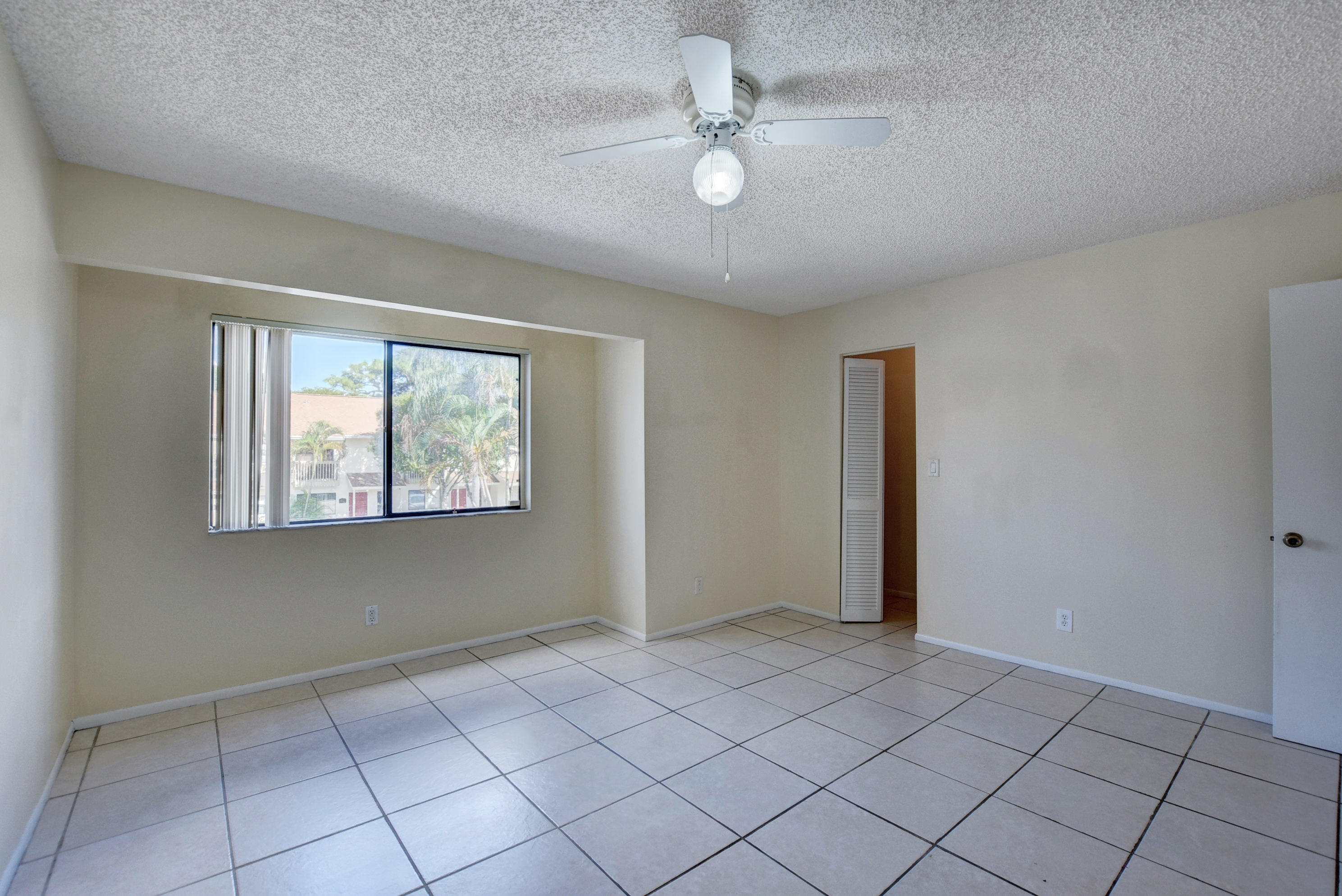 3603 Inlet Circle Greenacres, FL 33463 - Photo 23 of 34 a view of an empty room with a window