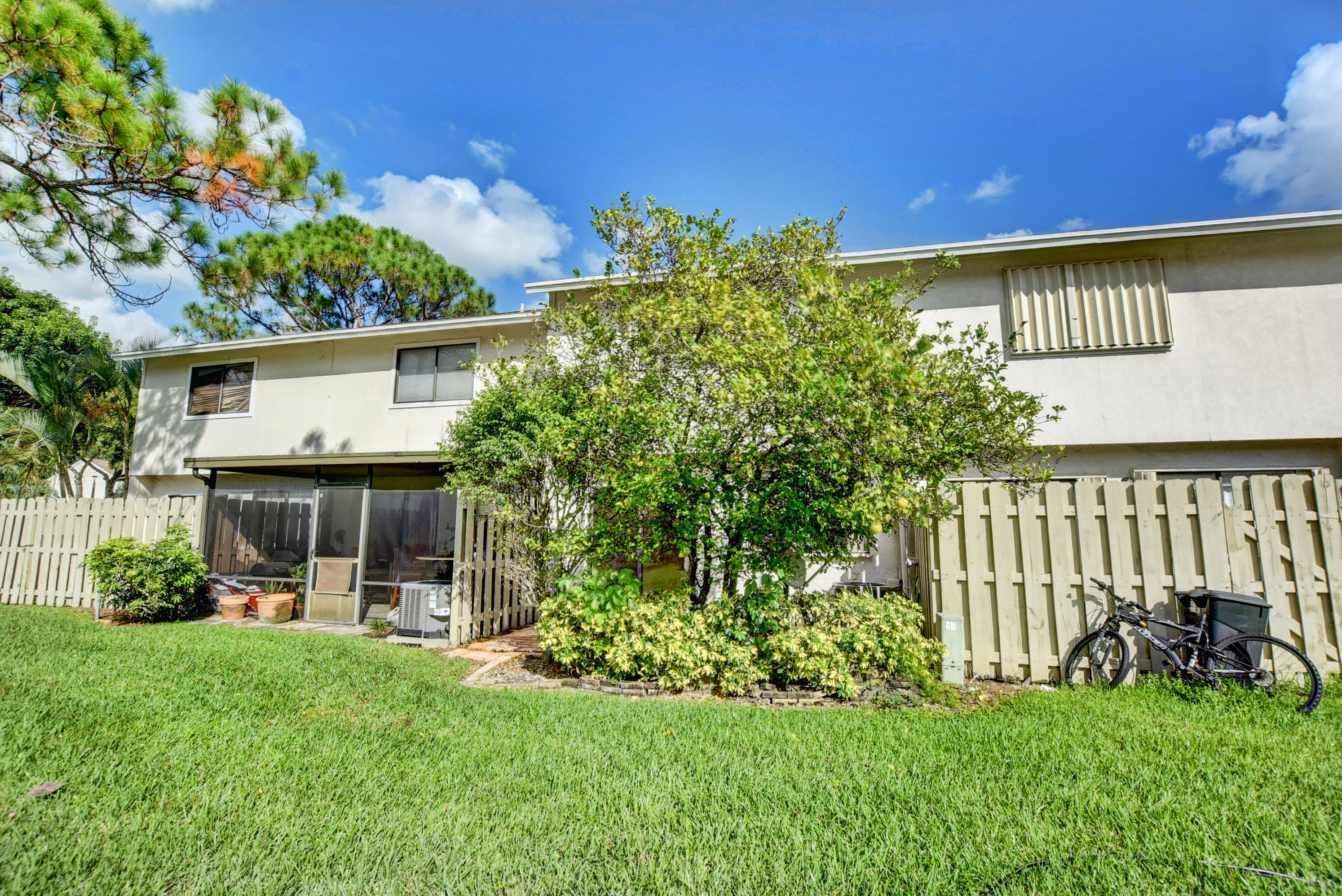 3603 Inlet Circle Greenacres, FL 33463 - Photo 31 of 34 a front view of a house with a yard