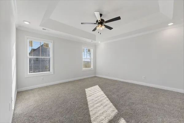 a view of room with window and ceiling fan