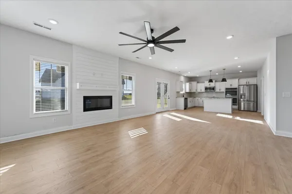 a view of a kitchen with a sink and a stove top oven