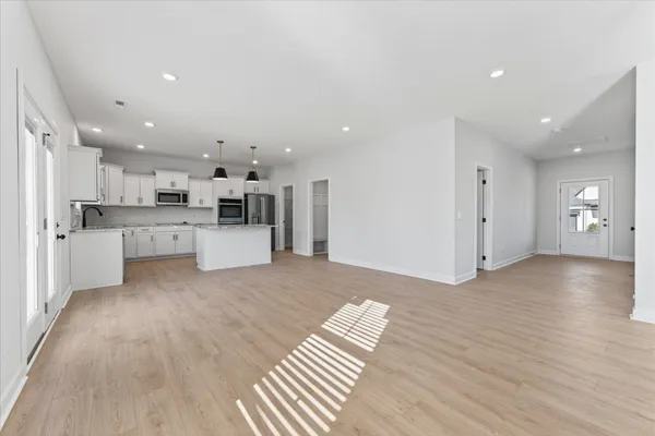 a view of kitchen with wooden floor