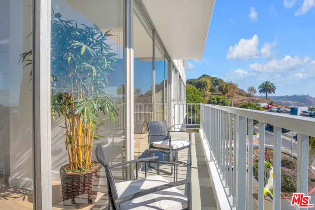 a view of balcony with glass door and glass door