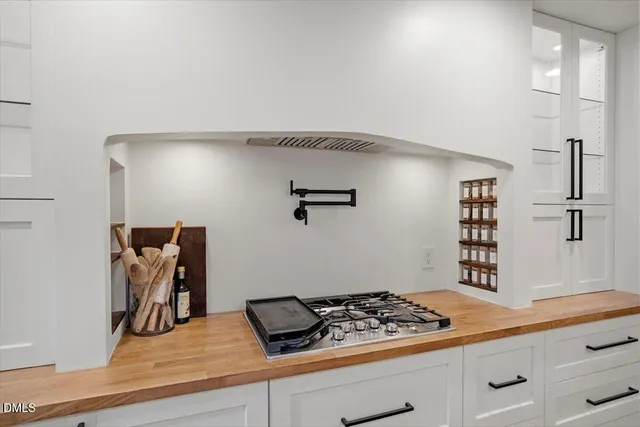 a kitchen with a cabinets and window