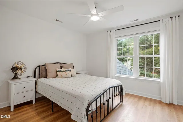 a bedroom with double bed and a window