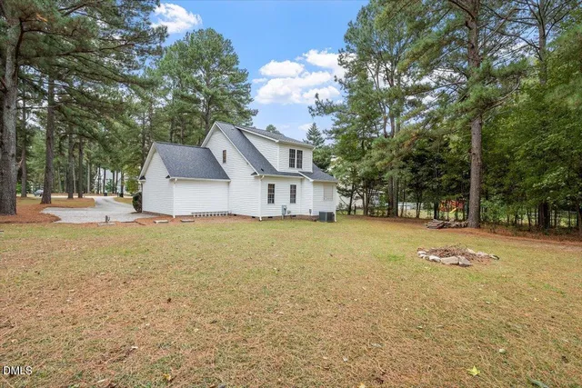 a house view with swimming pool in front of it