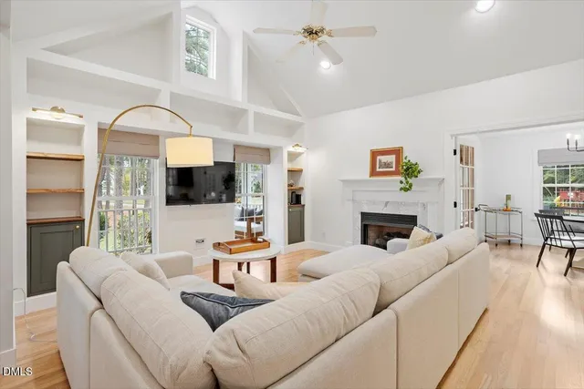 a living room with furniture fireplace and a flat screen tv