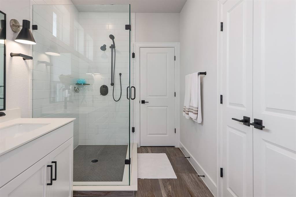 3907 Tilley Street Austin, TX 78723 - Photo 19 of 26 a bathroom with a sink and shower
