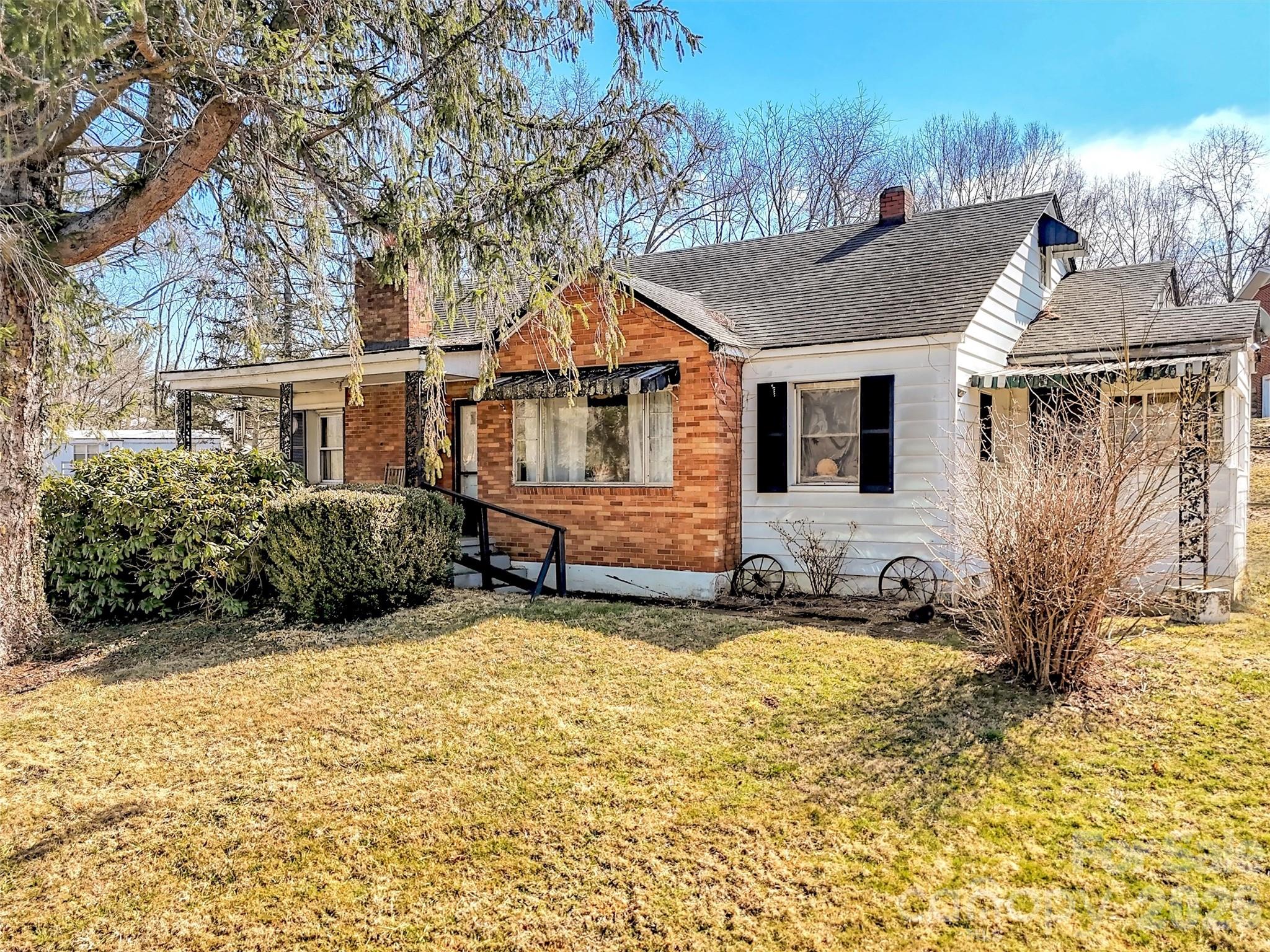 301 Mulberry Street Clyde, NC 28721 - Photo 1 of 23 a house view with a outdoor space