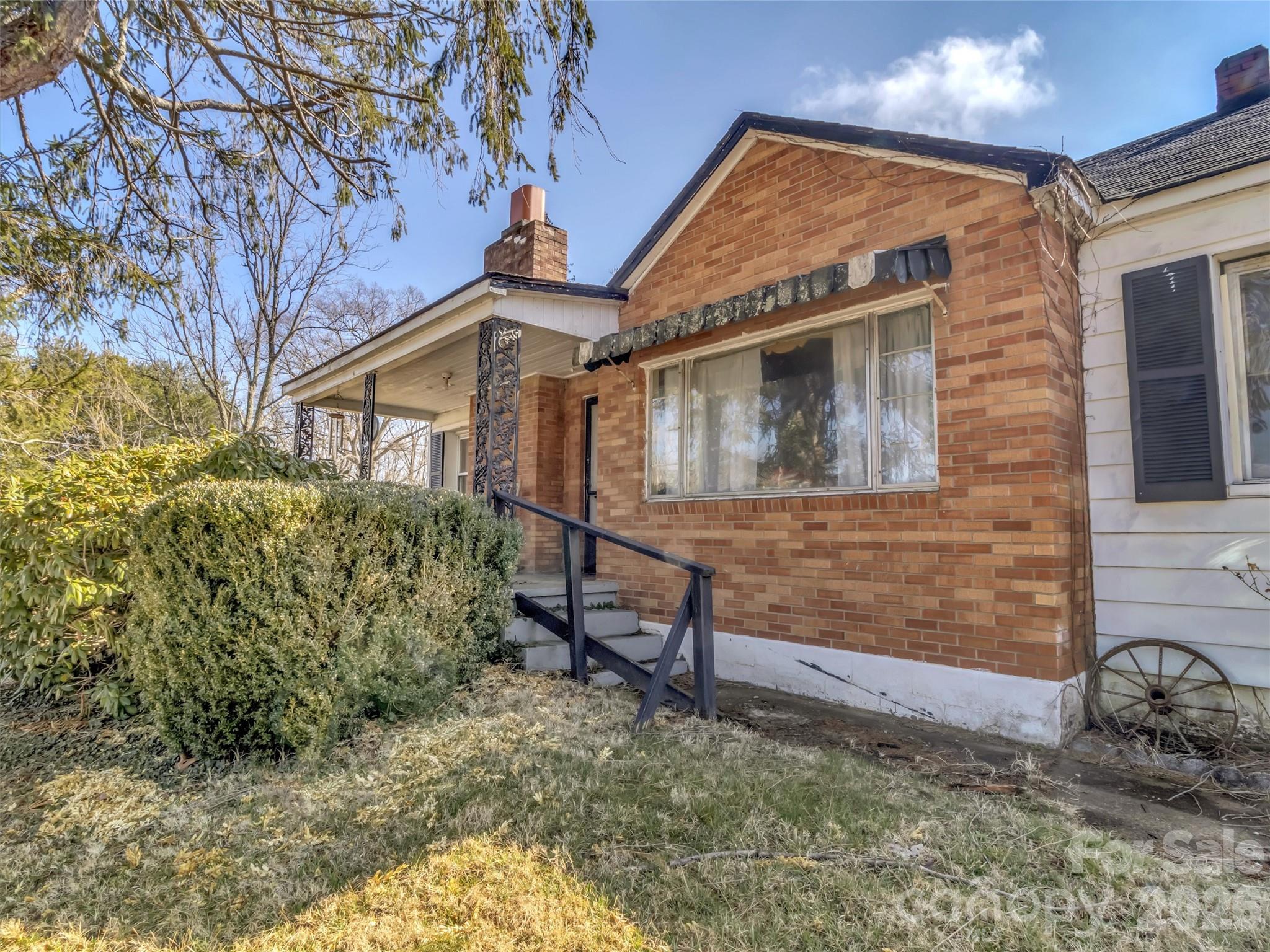 301 Mulberry Street Clyde, NC 28721 - Photo 13 of 23 a front view of a house with a yard