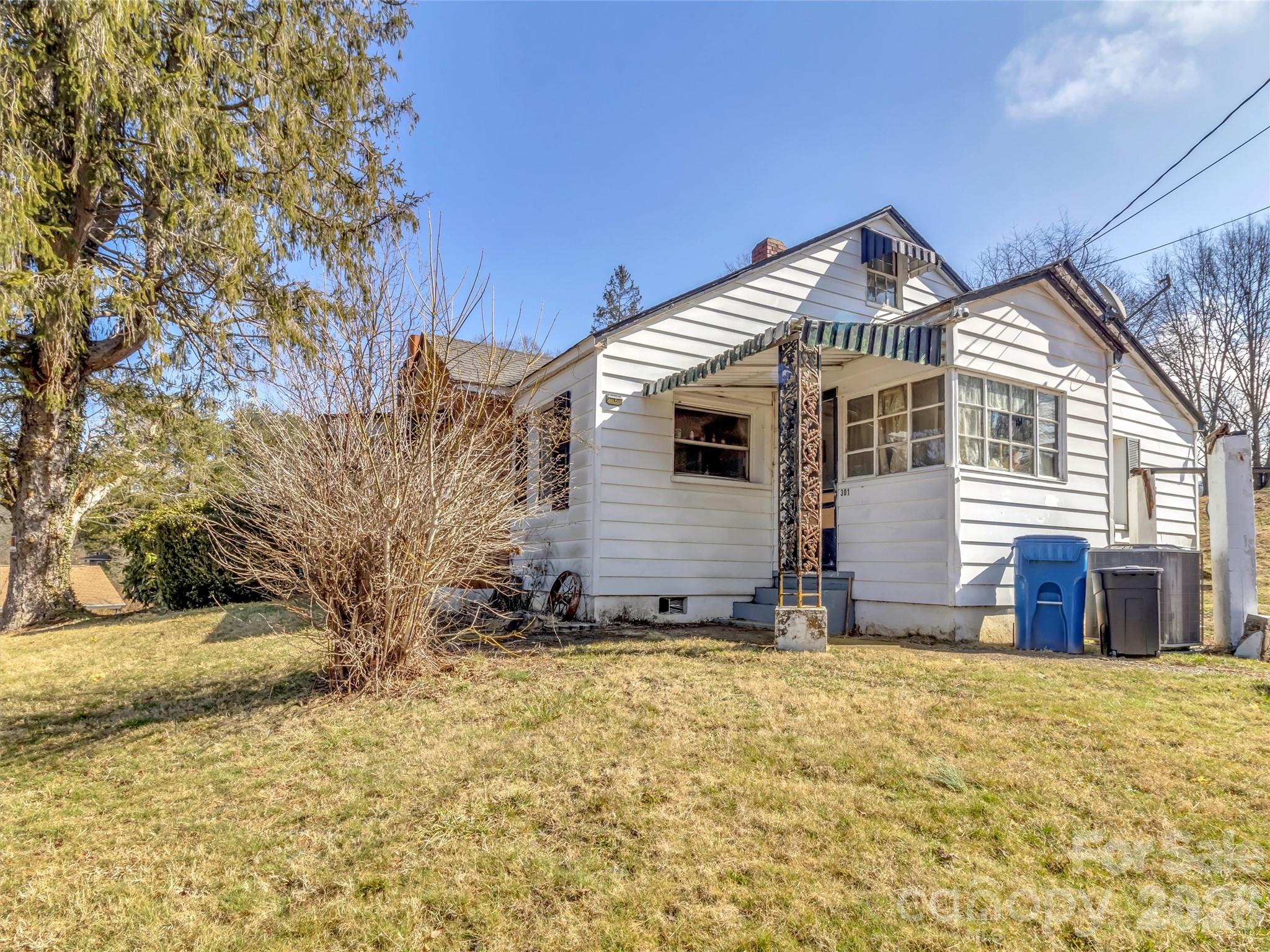 301 Mulberry Street Clyde, NC 28721 - Photo 14 of 23 a view of a house with a yard