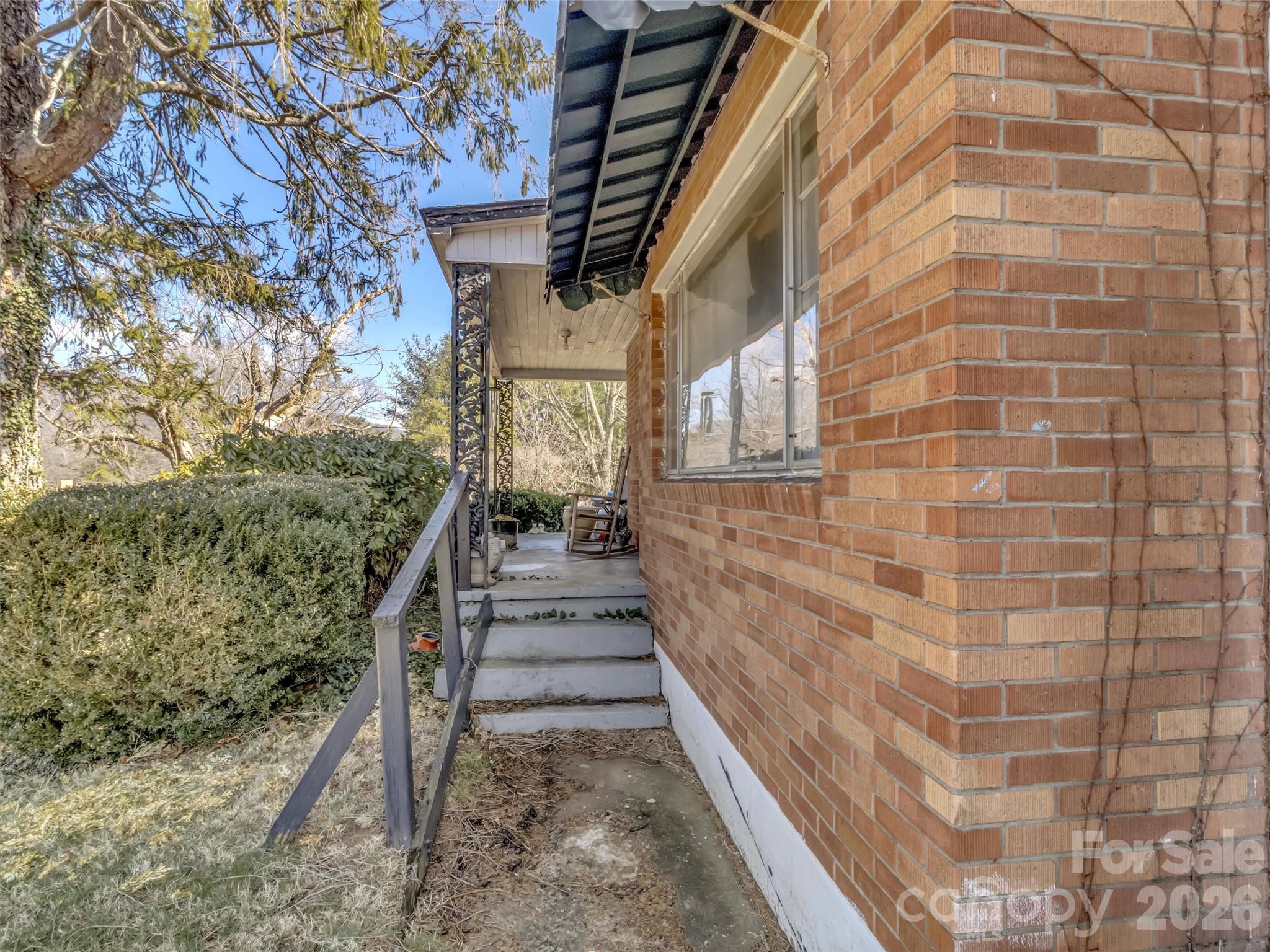 301 Mulberry Street Clyde, NC 28721 - Photo 3 of 23 a view of a pathway both side of building