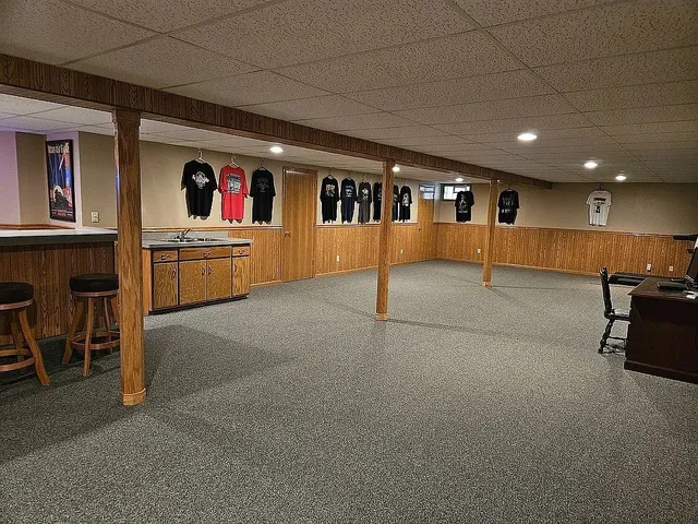 a big room with entryway table and chairs