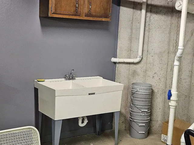 a bathroom with a sink a vanity and a mirror