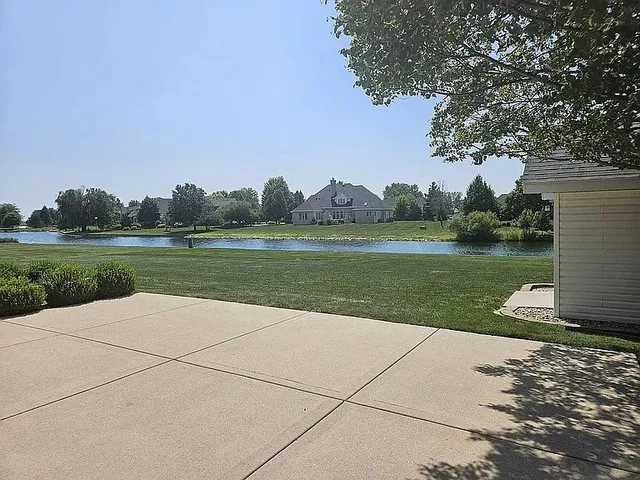 a view of a garden with a lake